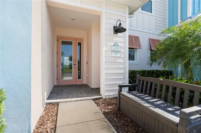 a front view of a house with a yard and a garage