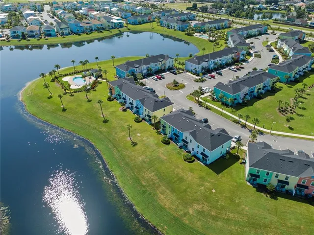 an aerial view of a house with a swimming pool yard and outdoor seating