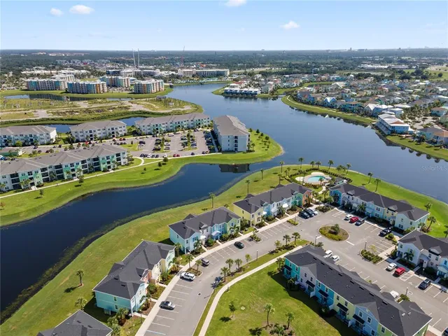 an aerial view of a city with lake view