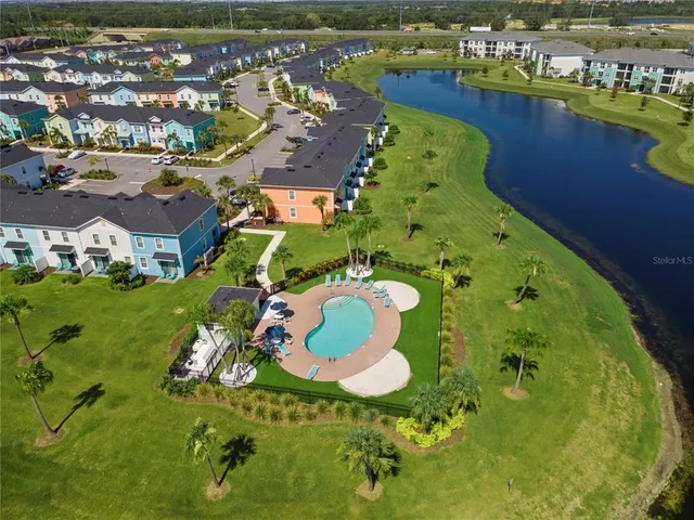 an aerial view of residential houses with outdoor space