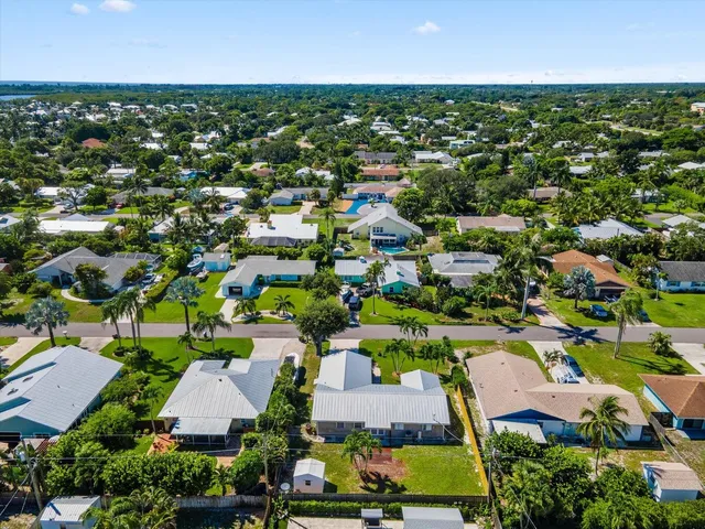 an aerial view of residential houses with outdoor space