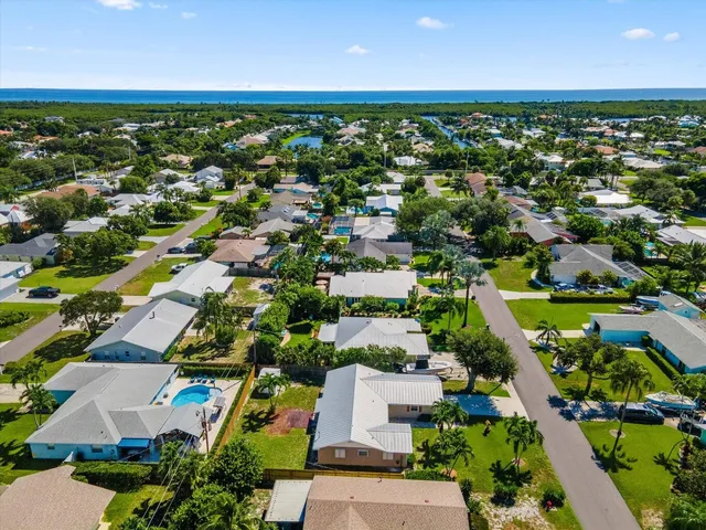 an aerial view of residential houses with outdoor space