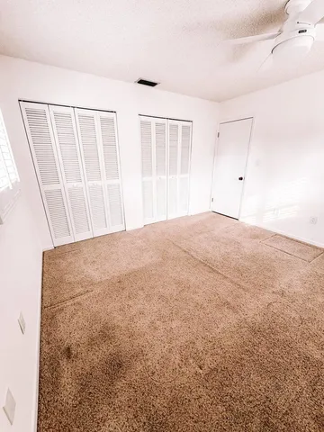 a view of kitchen with sink and cabinets