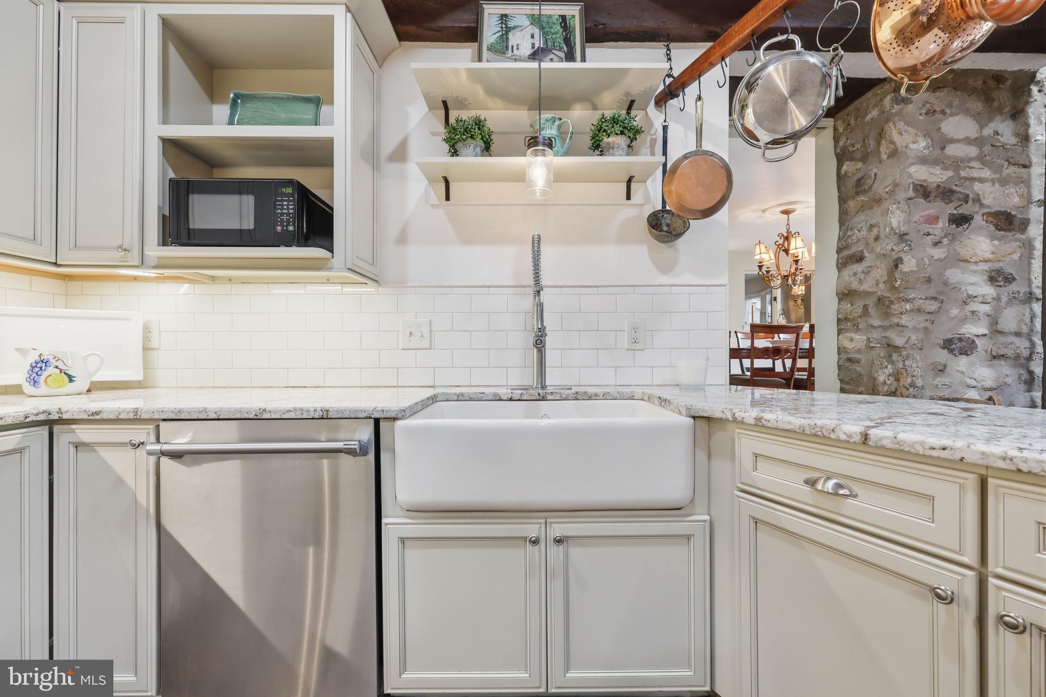 43 Twining Ford Road Richboro, PA 18954 - Photo 20 of 57 a kitchen with a sink and a stove with wooden floor
