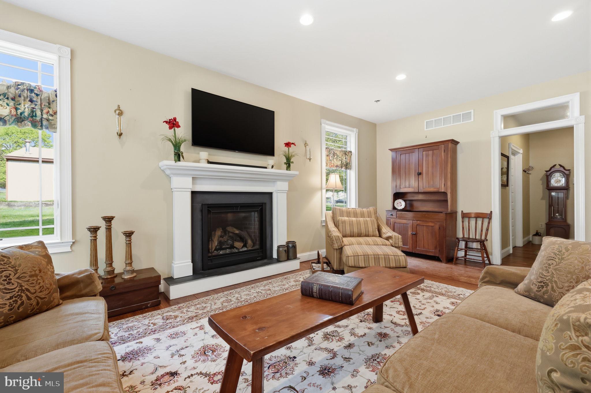 43 Twining Ford Road Richboro, PA 18954 - Photo 25 of 57 a living room with furniture flat screen tv and a fireplace