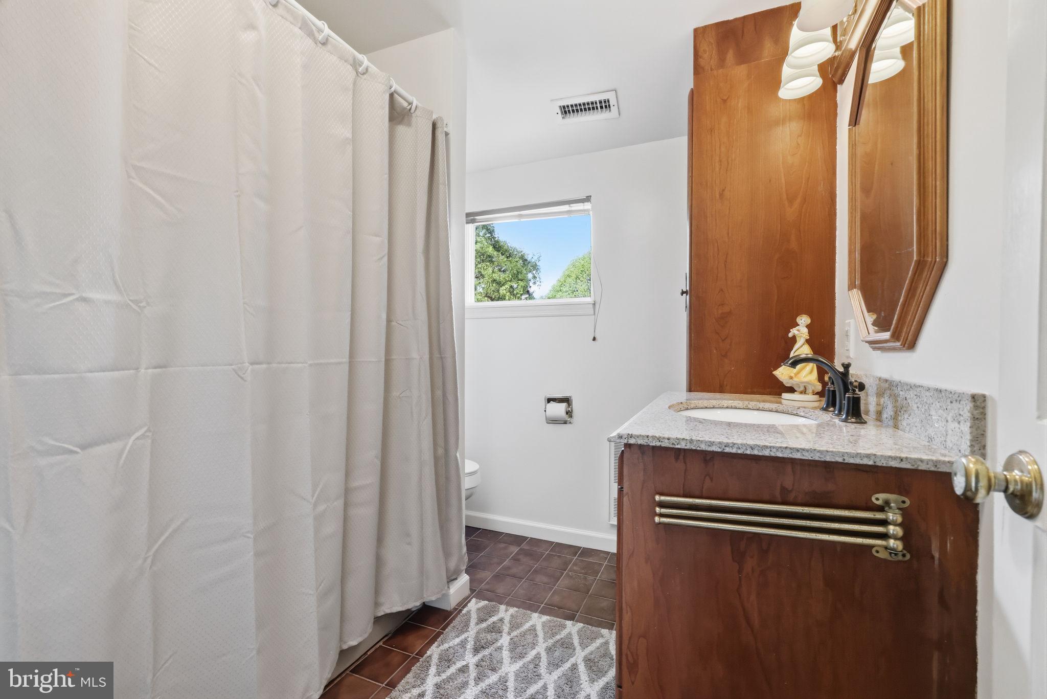 43 Twining Ford Road Richboro, PA 18954 - Photo 41 of 57 a bathroom with a granite countertop sink and a mirror