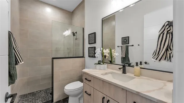 a view of an empty room with floor to ceiling windows