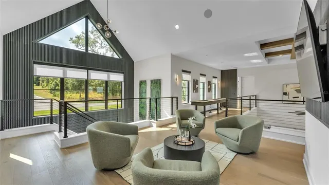 a view of a hallway with wooden floor and closet