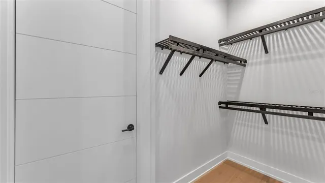 a view of a house with backyard water fountain and sitting area