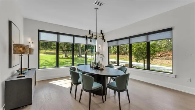 a dining room with furniture window wooden floor