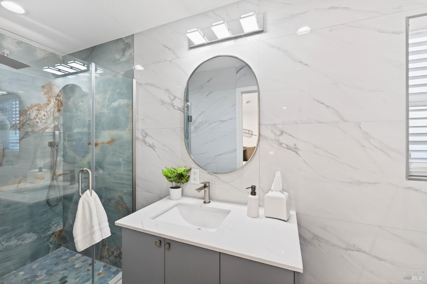 2447 Rigdon Street Napa, CA 94558 - Photo 58 of 79 a bathroom with a sink and mirror