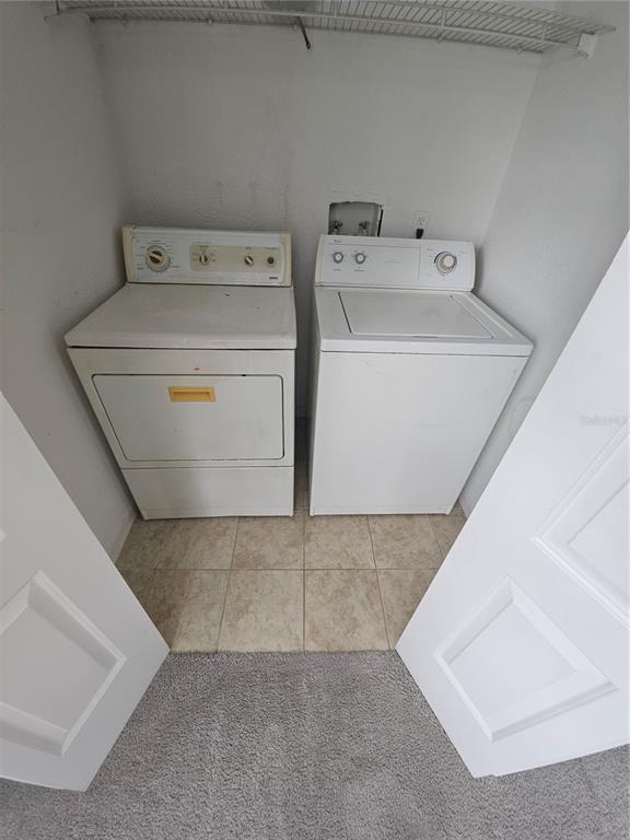 5160 Conroy Road, Unit 1437 Orlando, FL 32811 - Photo 11 of 36 a utility room with dryer and washer