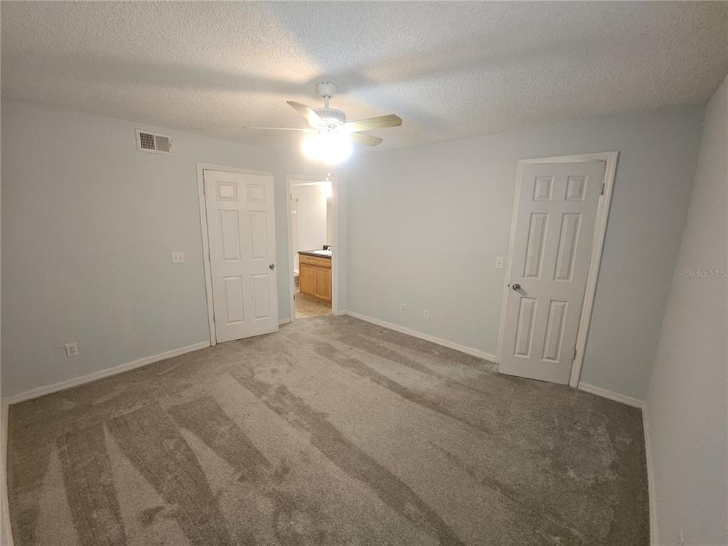 5160 Conroy Road, Unit 1437 Orlando, FL 32811 - Photo 20 of 36 a view of an empty room and a ceiling fan