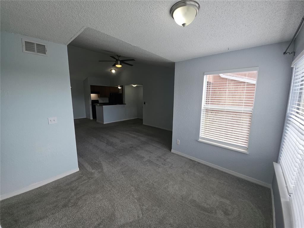5160 Conroy Road, Unit 1437 Orlando, FL 32811 - Photo 6 of 36 a view of an empty room with a window
