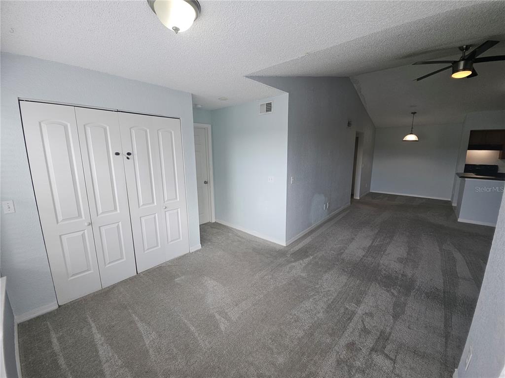 5160 Conroy Road, Unit 1437 Orlando, FL 32811 - Photo 8 of 36 a view of a livingroom with a kitchen space