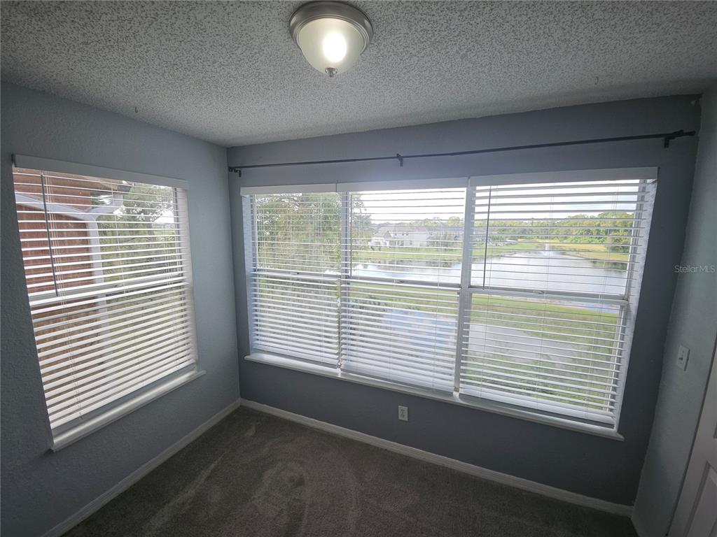 5160 Conroy Road, Unit 1437 Orlando, FL 32811 - Photo 10 of 36 a view of an empty room with a window