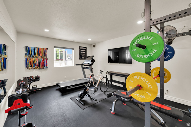 1132 South 1300th Street West Mapleton, UT 84664 - Photo 37 of 52 Dedicated fitness space featuring rubberized flooring, recessed lighting, and a wall-mounted display