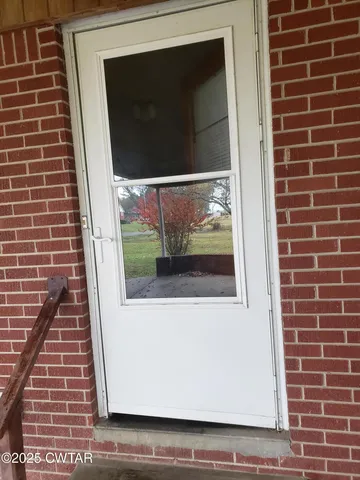 a large kitchen with stainless steel appliances granite countertop a stove a sink and a refrigerator