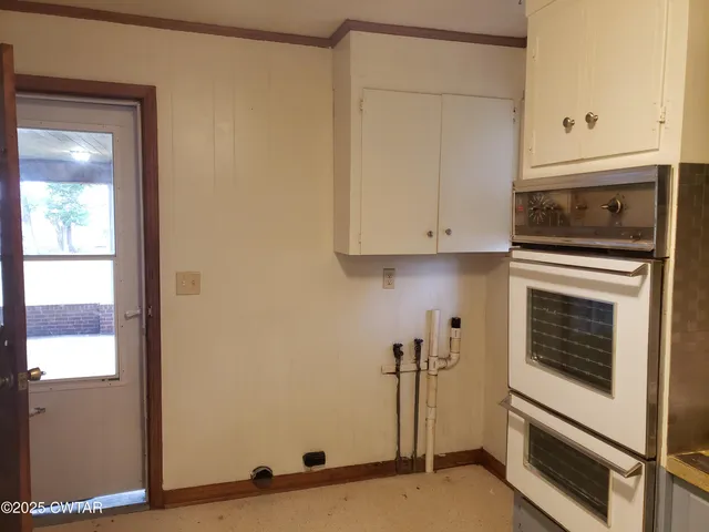 a view of a kitchen with electric appliances