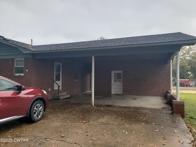 a car parked in front of a house