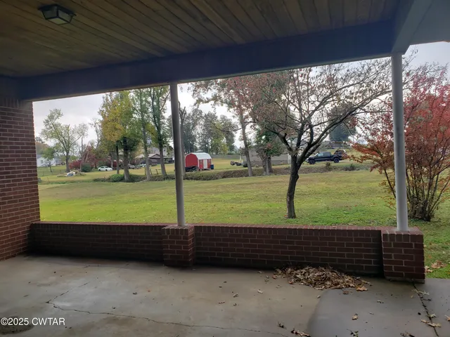 a view of a tree in front of a house