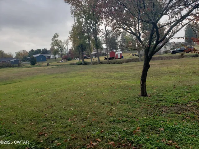 a view of a wooden door of the house