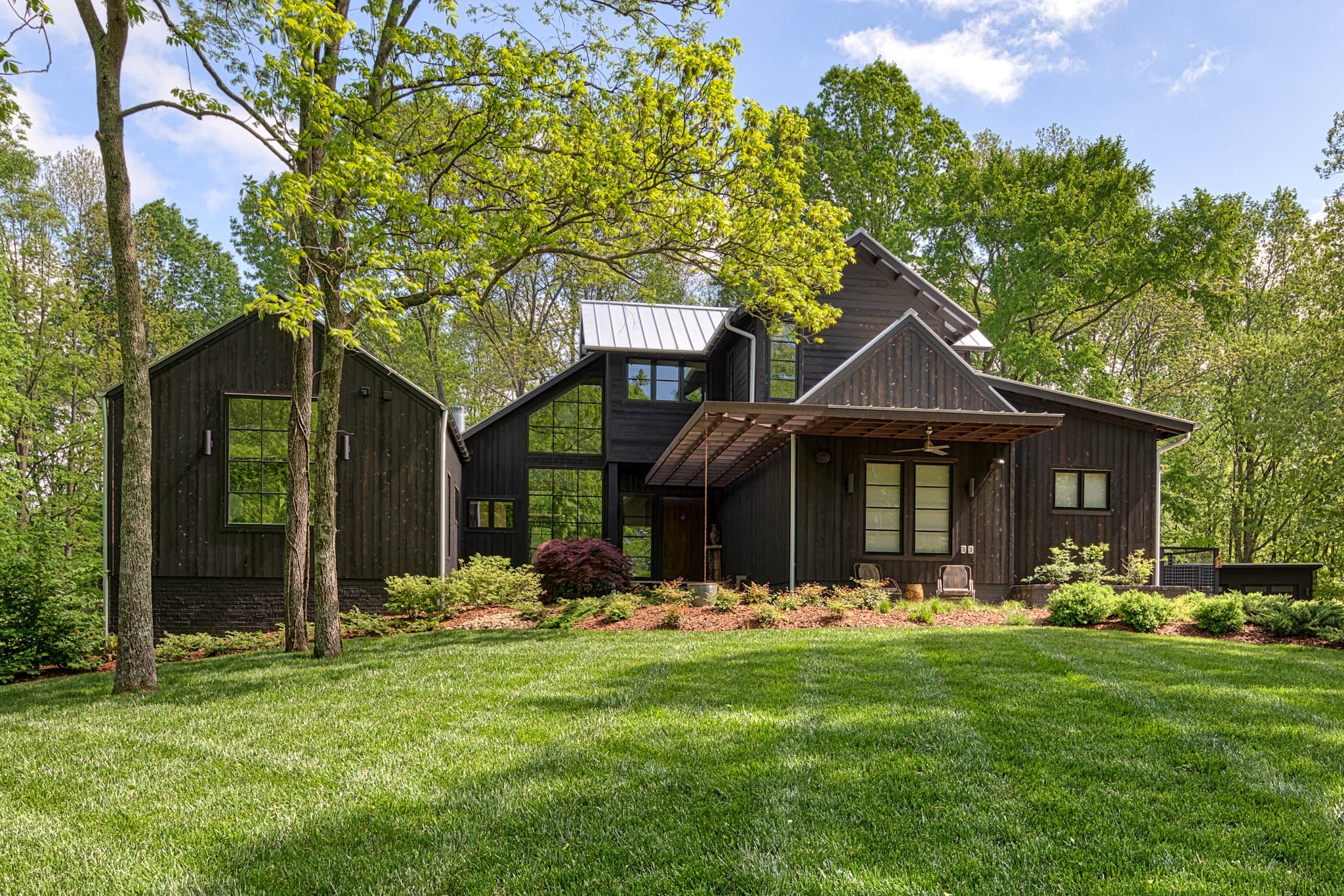 1075 E Webb Ridge Road Kingston Springs, TN 37082 - Photo 1 of 1 a front view of a house with a yard