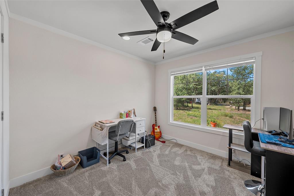 3050 Clater Powell Road Waco, TX 76705 - Photo 30 of 39 a view of a workspace with furniture and a window