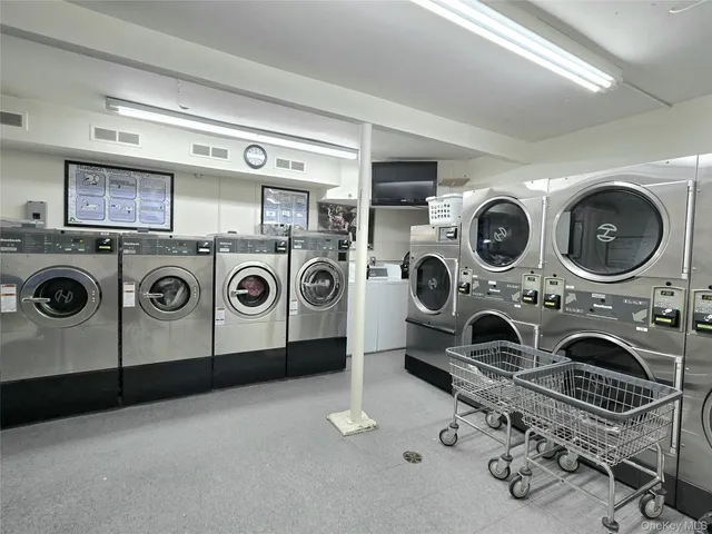 a utility room with dryer washer and other items