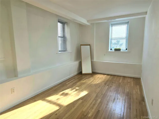 a view of an empty room and window
