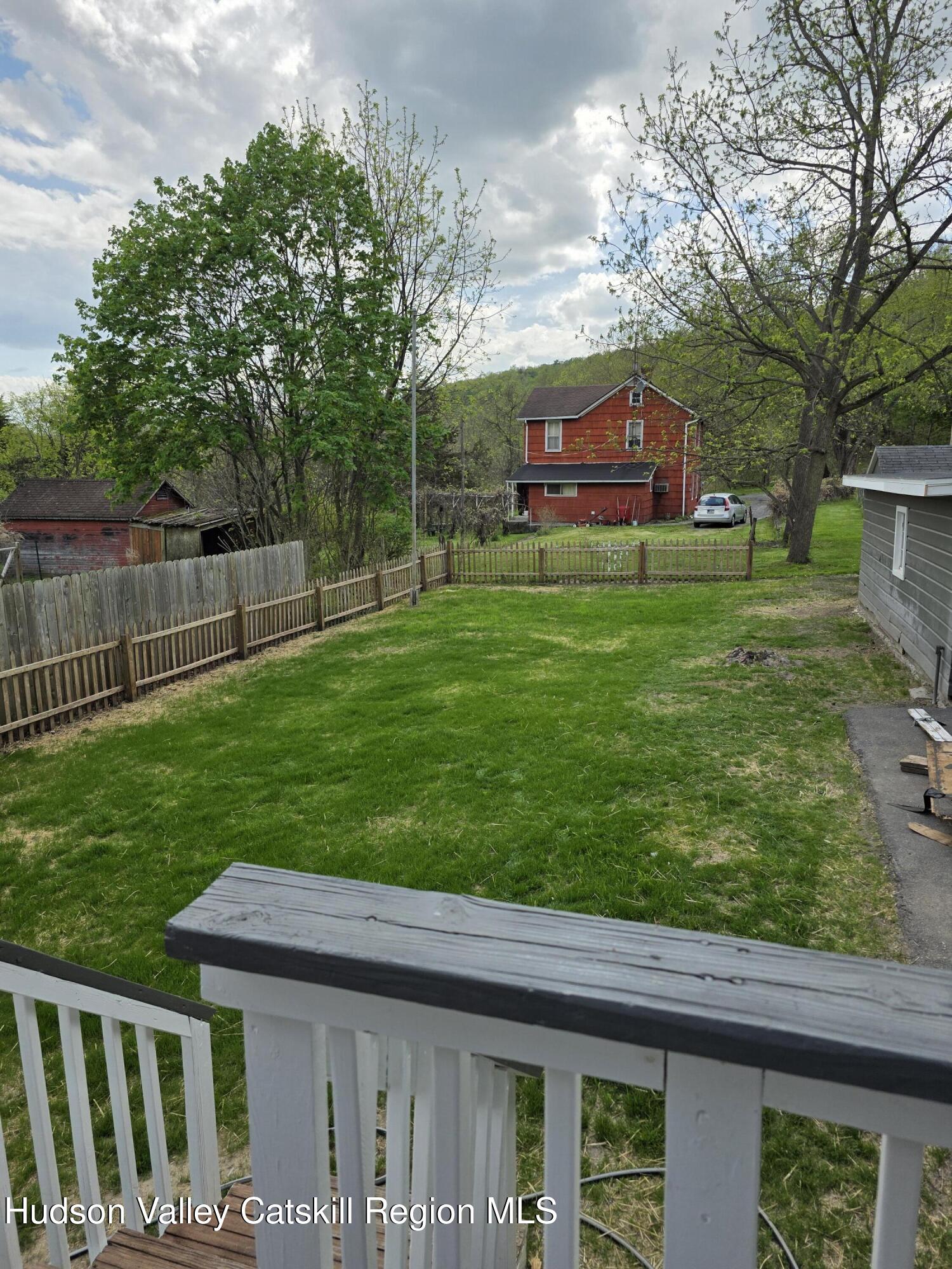 22 Maple Street Catskill, NY 12414 - Photo 15 of 16 a front view of a house with a yard table and chairs