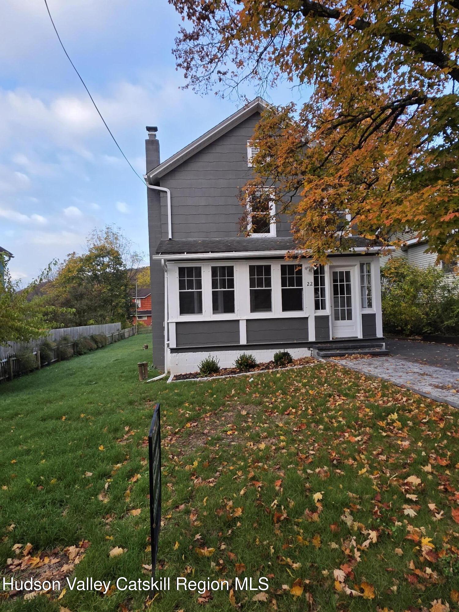 22 Maple Street Catskill, NY 12414 - Photo 2 of 16 a house view with a garden space