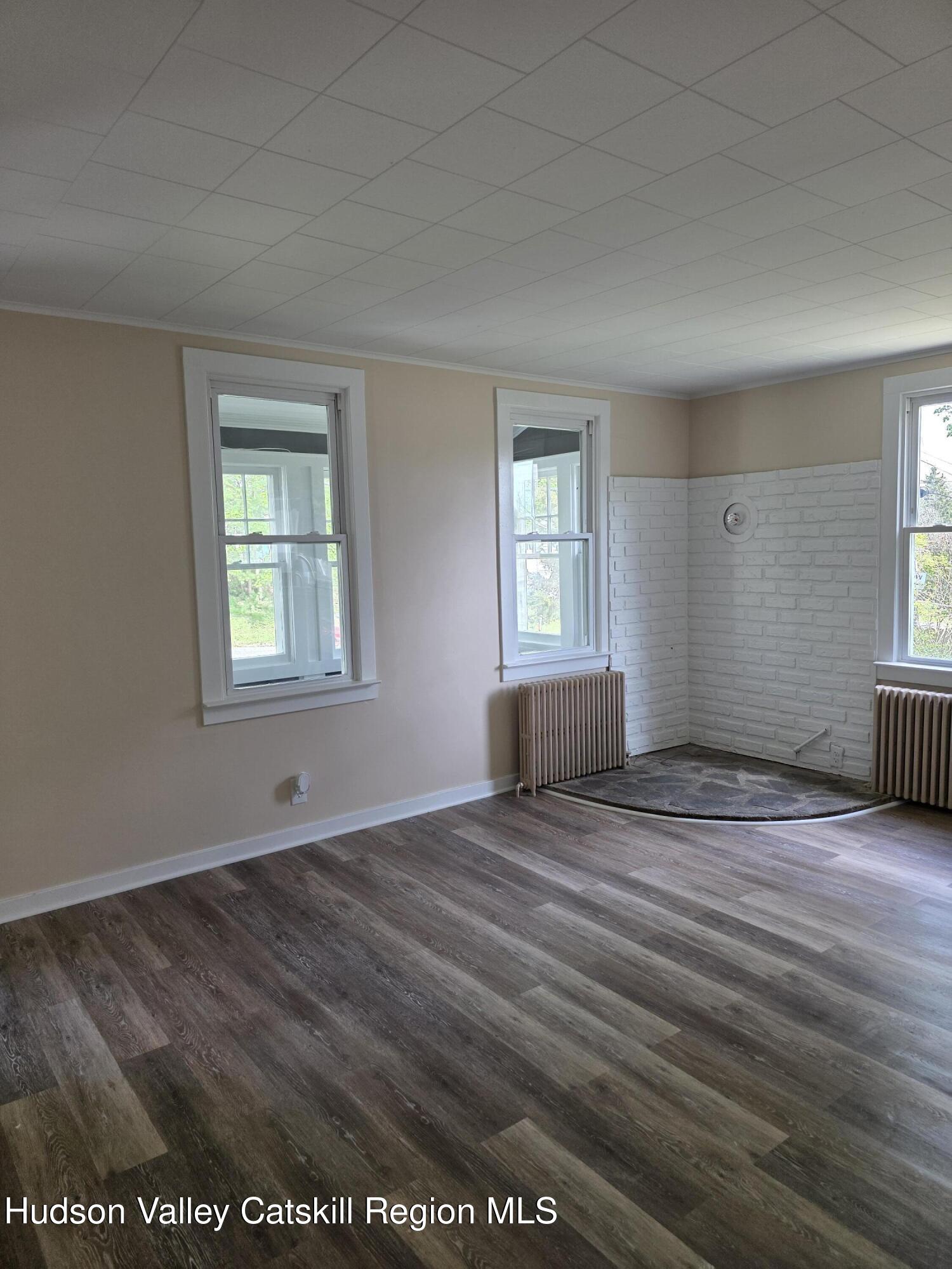 22 Maple Street Catskill, NY 12414 - Photo 4 of 16 an empty room with window