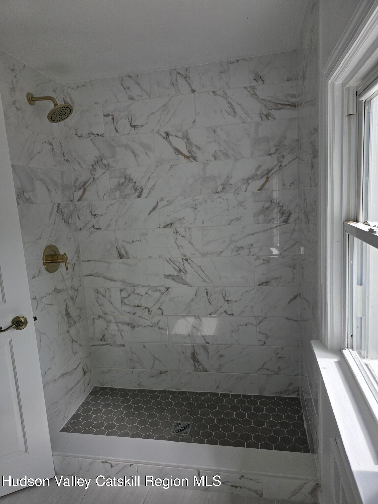 22 Maple Street Catskill, NY 12414 - Photo 8 of 16 a bathroom with a shower