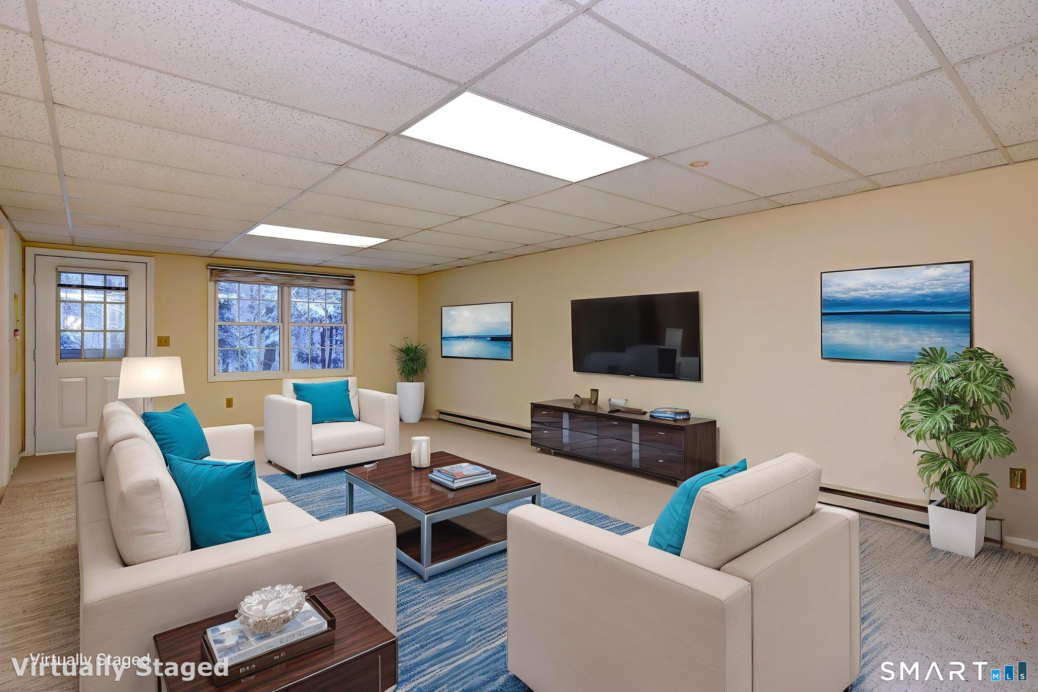 a living room with furniture and a flat screen tv