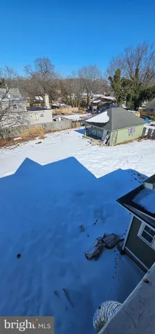 a view of an empty room with windows