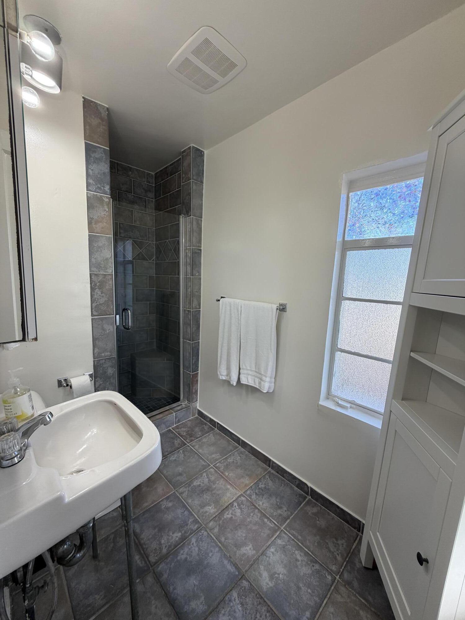 316 Oceano Avenue, Unit B Santa Barbara, CA 93109 - Photo 11 of 17 a bathroom with a sink and a mirror