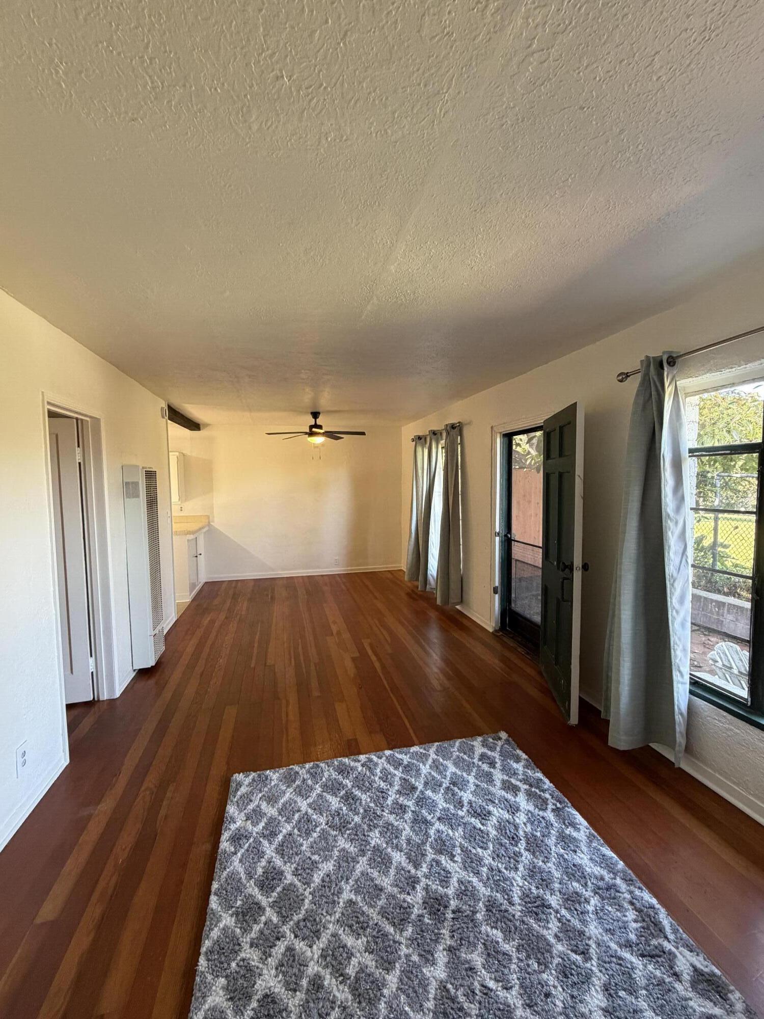 316 Oceano Avenue, Unit B Santa Barbara, CA 93109 - Photo 15 of 17 wooden floor in an empty room with a window
