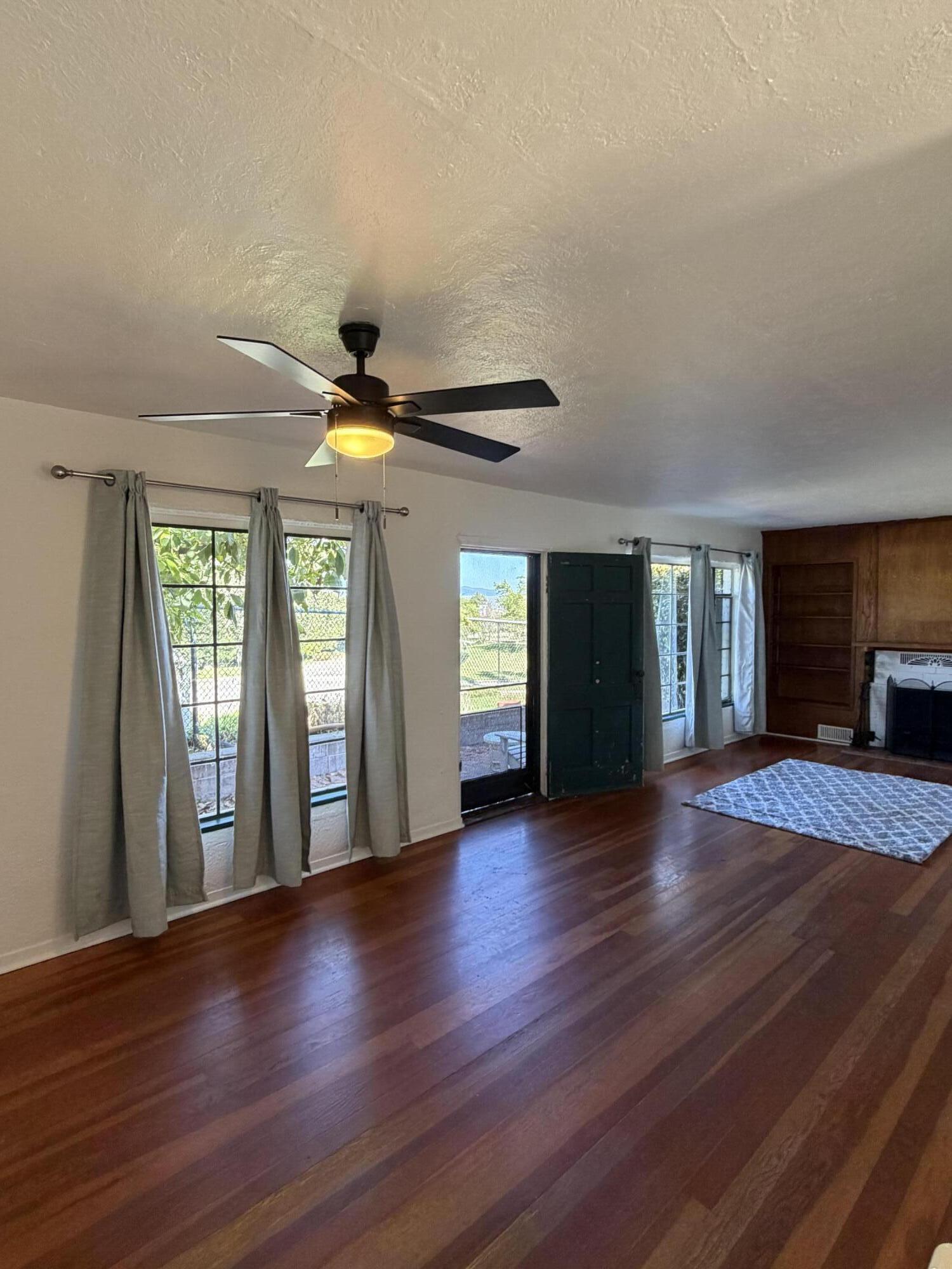 316 Oceano Avenue, Unit B Santa Barbara, CA 93109 - Photo 4 of 17 a view of an empty room with window and wooden floor