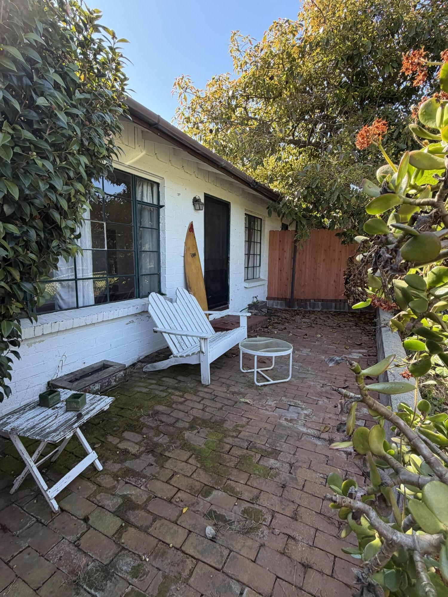 316 Oceano Avenue, Unit B Santa Barbara, CA 93109 - Photo 5 of 17 a view of a backyard with chairs and a tree