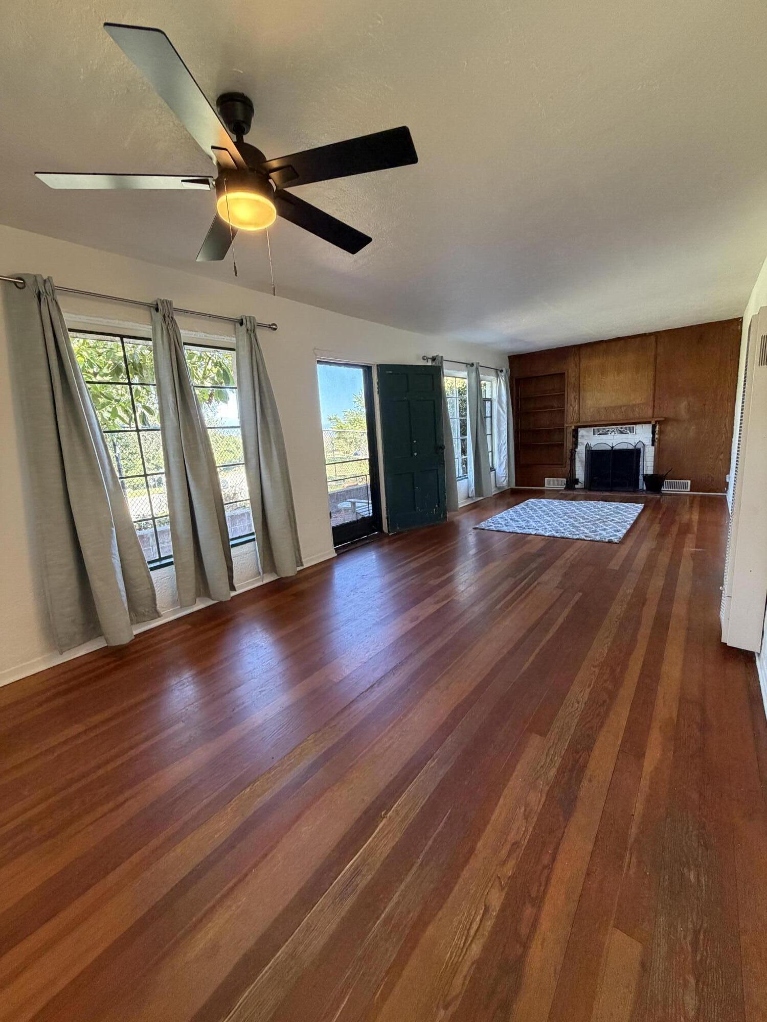 316 Oceano Avenue, Unit B Santa Barbara, CA 93109 - Photo 7 of 17 a view of an empty room with wooden floor and a window