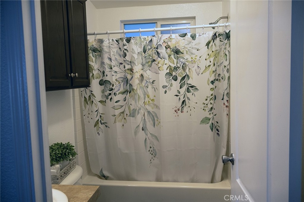 2499 East Gerard, Unit 123 Merced, CA 95341 - Photo 12 of 15 a bathroom with a bathtub and shower
