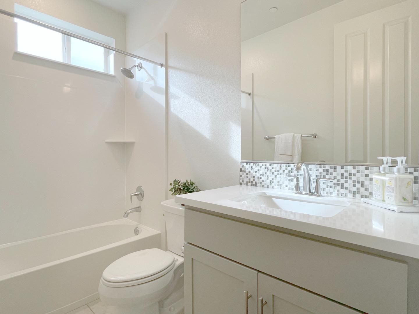 716 Amalfi Loop Milpitas, CA 95035 - Photo 12 of 28 a bathroom with a sink toilet vanity and shower
