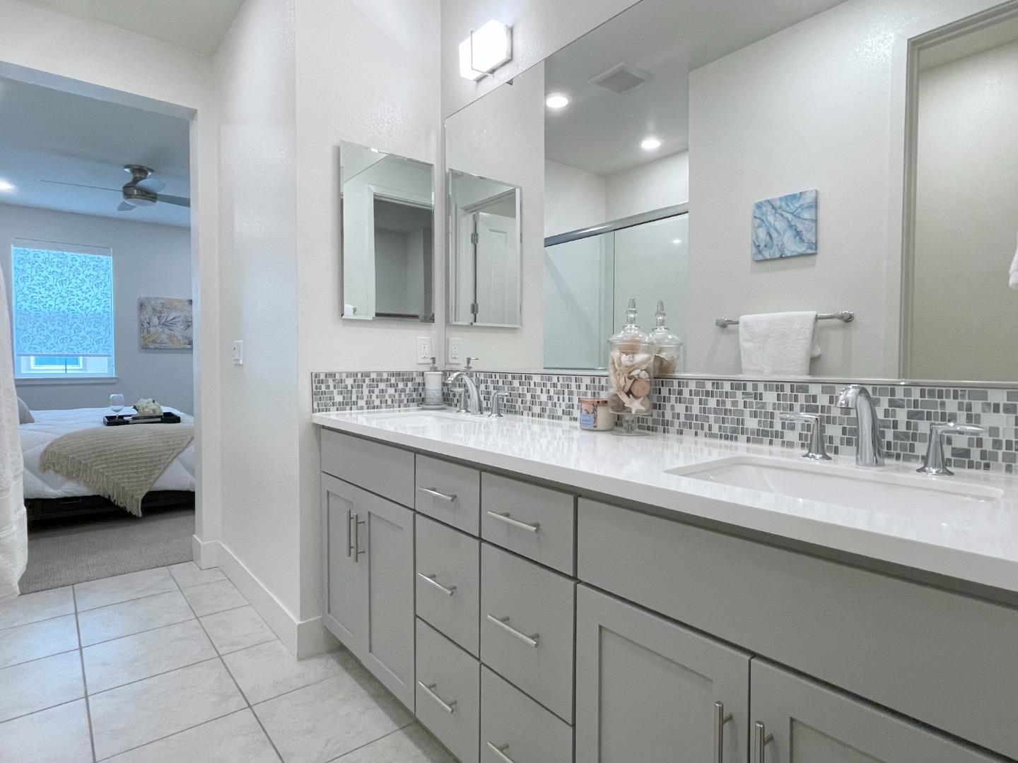 716 Amalfi Loop Milpitas, CA 95035 - Photo 19 of 28 a en suite bathroom with a double vanity sink and mirror