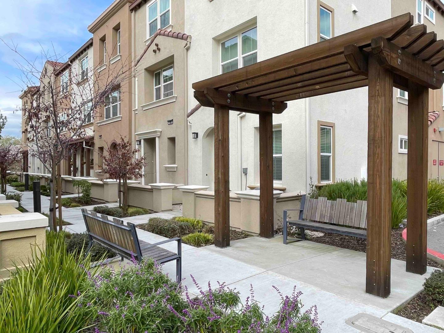 716 Amalfi Loop Milpitas, CA 95035 - Photo 23 of 28 a view of a patio with couches table and chairs and potted plants