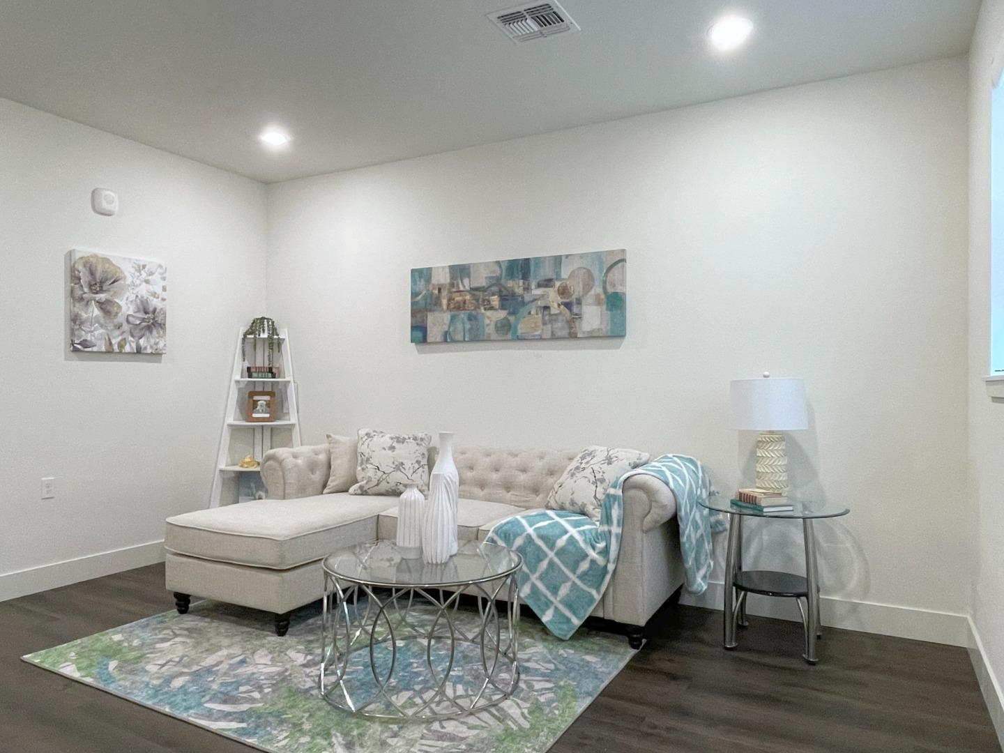 716 Amalfi Loop Milpitas, CA 95035 - Photo 3 of 28 a living room with furniture and a rug