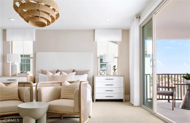 a living room with furniture a flat screen tv and a window