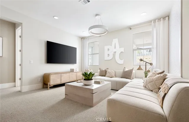 a bed room with furniture and a chandelier
