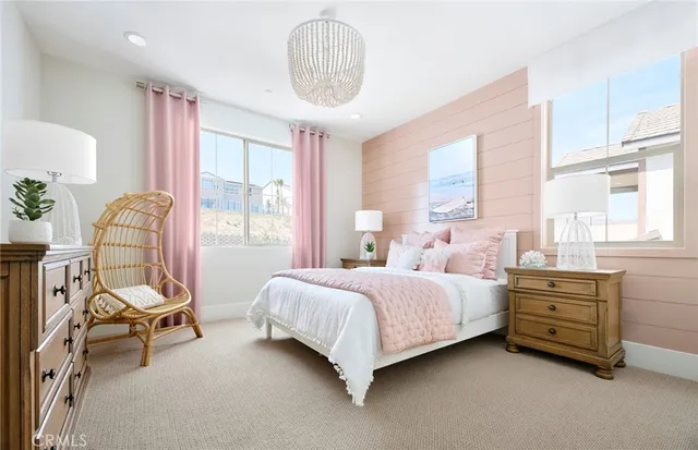 an aerial view of residential houses with outdoor space and parking