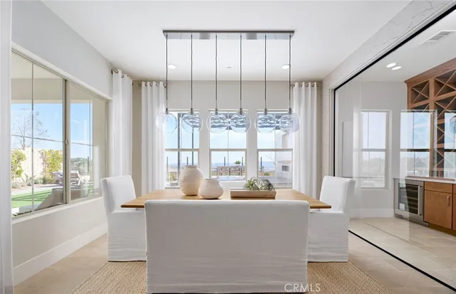 a bed room with furniture and a chandelier